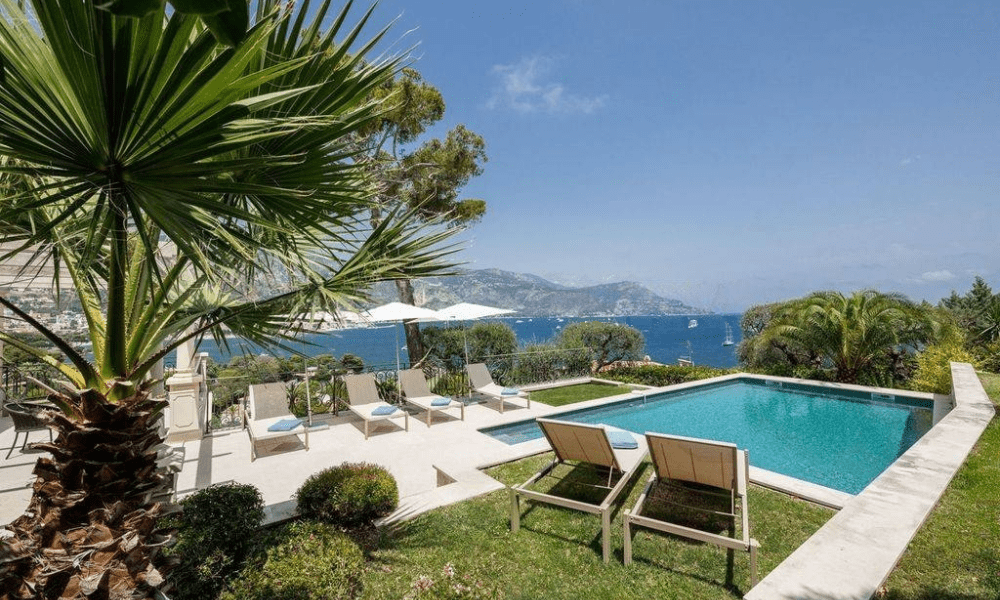Evening pool and terrace setting with warm lighting